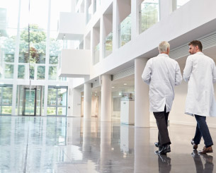 Two optometrist walking down the hall.