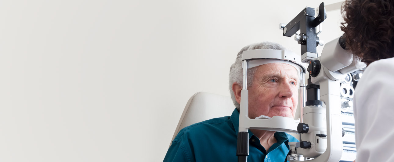 Mature man getting an eye exam.