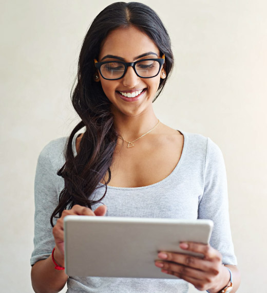 Woman holding a tablet.