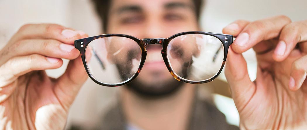 Man looking through glasses